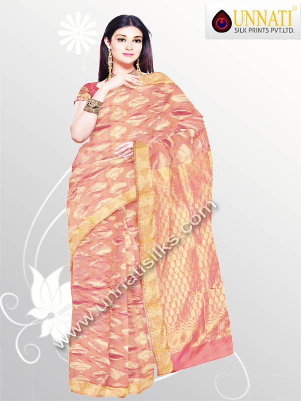 Dazzling orange color with pink shading uppada pure silk pattu saree. This uppada pure silk pattu sari has got gold color handcrafted ethnic design . And it has got golden zari floral design border and elegant pattu work designer pallu is suitable for wedding and party wear